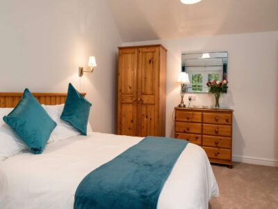 Spacious bedroom with plenty of wardrobe space and chest of drawers self catering cottage North Wales Coast